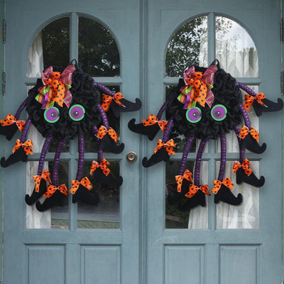Creative Halloween multi-legged spider door hanging wreath with orange bows and large green eyes on blue double doors