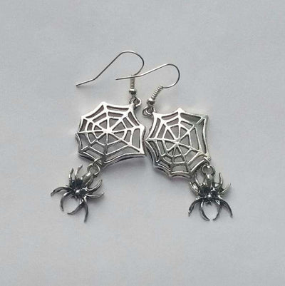 Silver spider web Halloween earrings with dangling spiders, gothic metal jewelry for unisex.