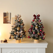 Two 45cm desktop Christmas trees with festive decorations and lights on a white mantelpiece