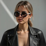 2025 New ND dimmable sunglasses with round TAC lenses and aluminum magnesium full rim frame worn by woman in black leather jacket